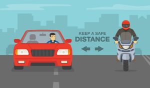 Safe driving guidelines with red sedan car and sport motorcycle on highway