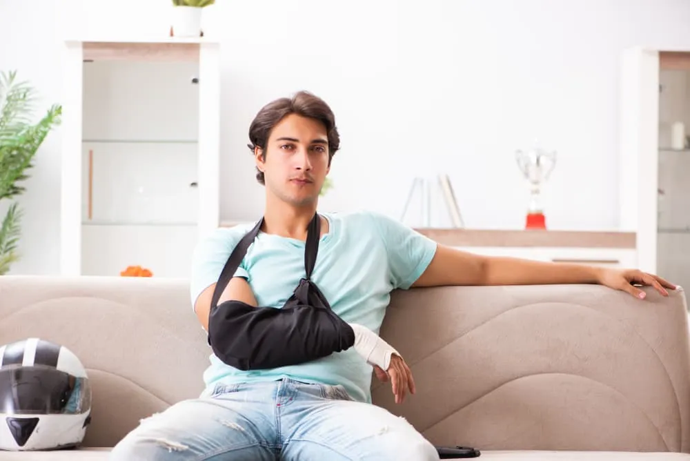 Motorcyclist resting at home while recovering from injuries.