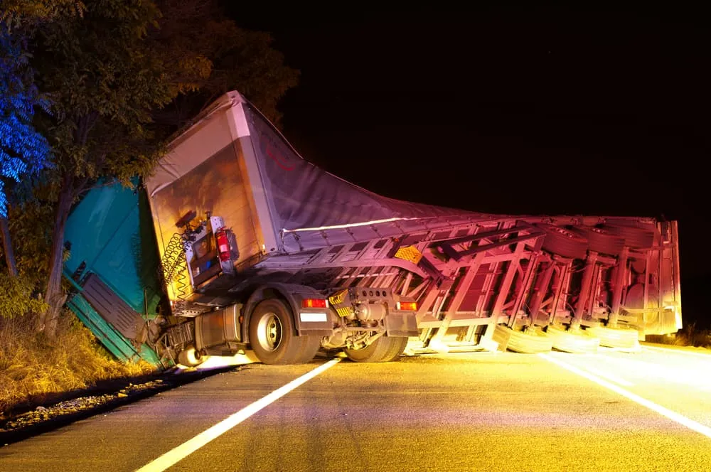Truck Overturned On Road At Night