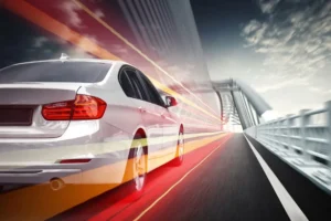 Car speeding on the highway bridge. 