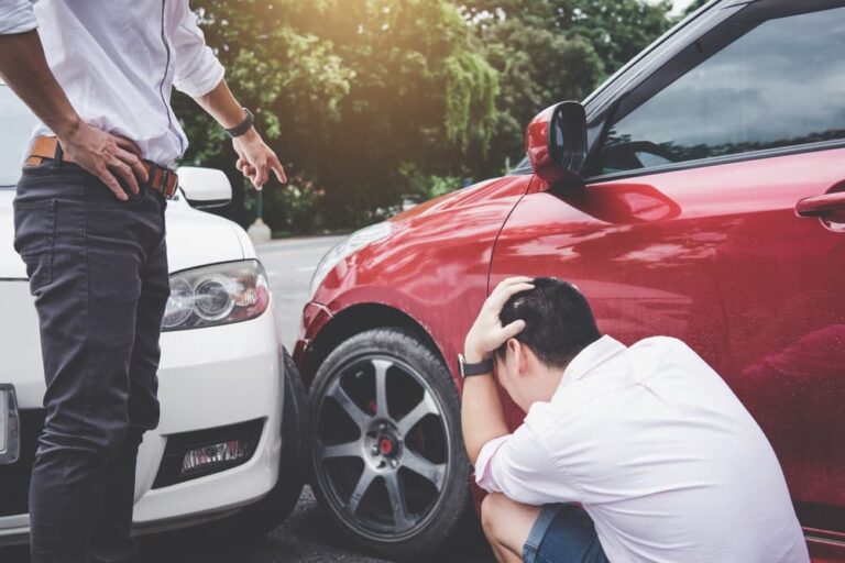 Two drivers argue intensely after a crash, highlighting issues related to traffic accidents and insurance disputes.