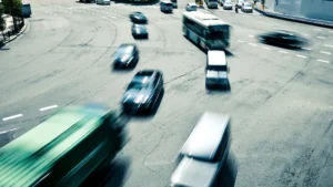 The intersection is bustling with cars amidst heavy traffic on the road.