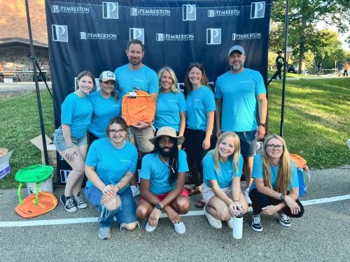 Employees of Pemberton Personal Injury Law Firm pose for a photo at Lake View Elementary in Madison, Wisconsin