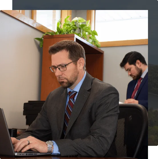 personal injury lawyer will pemberton works at his laptop in the office