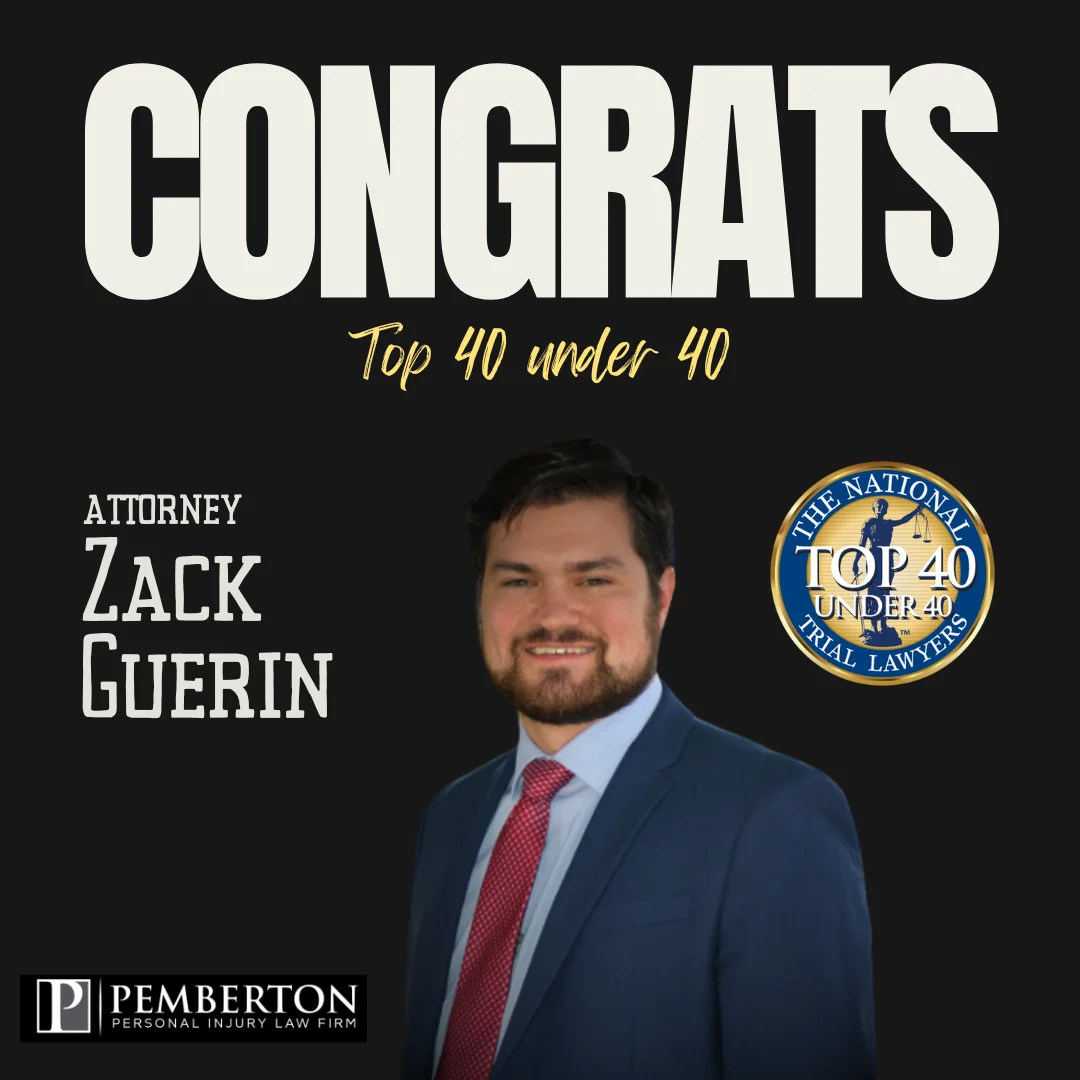 attorney Zack Guerin poses in a blue suit as part of a congrats graphic for his selection in top 40 under 40 by national trial lawyers