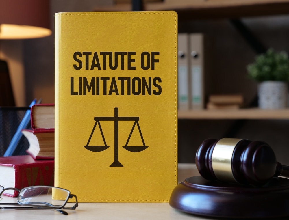 A closeup of an Statute of Limitations book and a Gavel