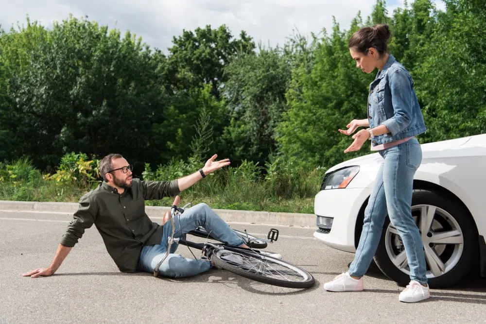 Driver And Cyclist Arguing After A Road Accident