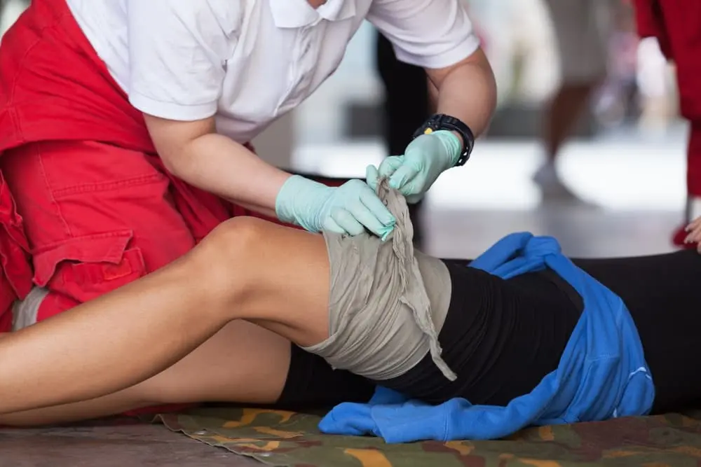 First Aid On Their Leg After An Injury