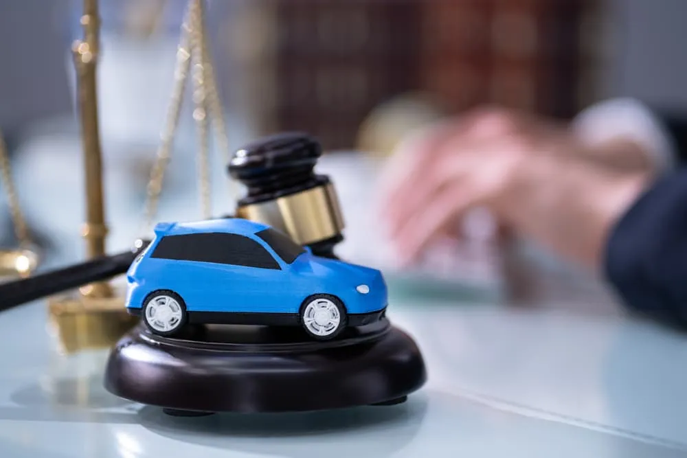 Legal Professional Reviewing Car Insurance Documents