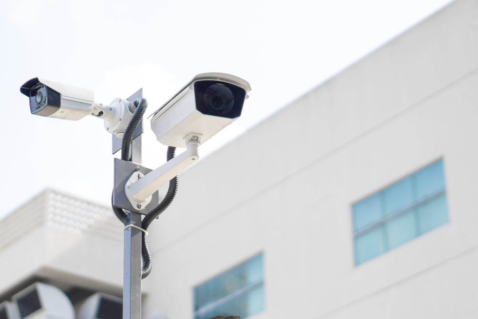CCTV surveillance security camera mounted outdoors on a pole